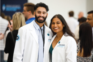 A man and a woman in doctor coats.