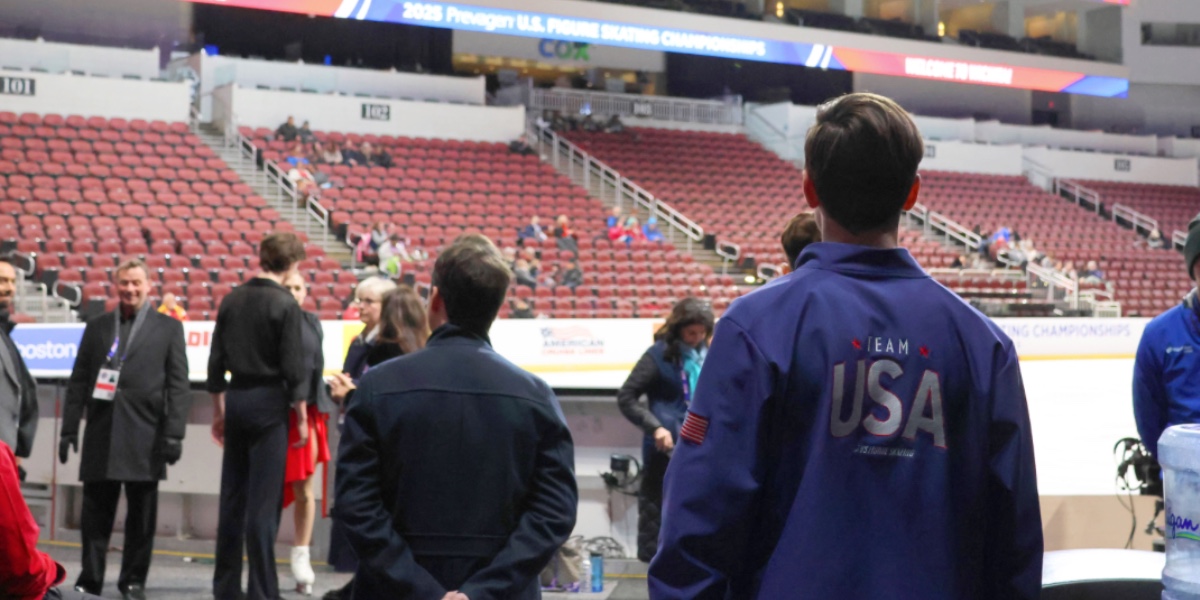 People stand around an ice rink at the US Figure Skating Championships in 2025.